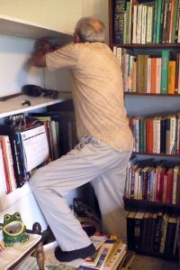 Dale fixing the bookshelf